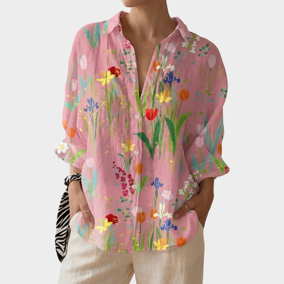 Close-up of the botanical print and button closure on a casual floral shirt for women