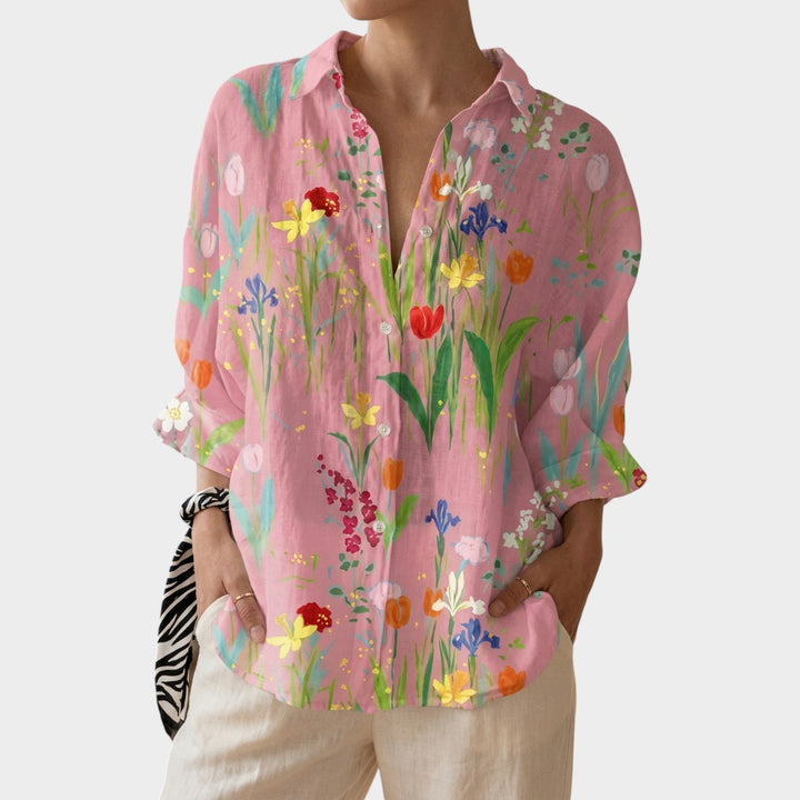 Close-up of the botanical print and button closure on a casual floral shirt for women