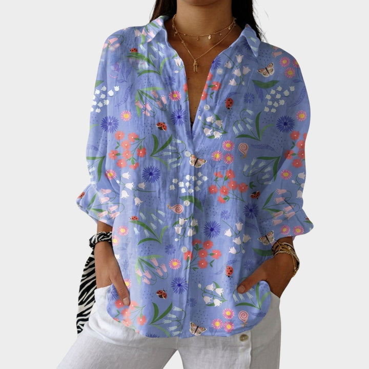 Womens floral garden button up blouse featuring a vibrant botanical print and long sleeves