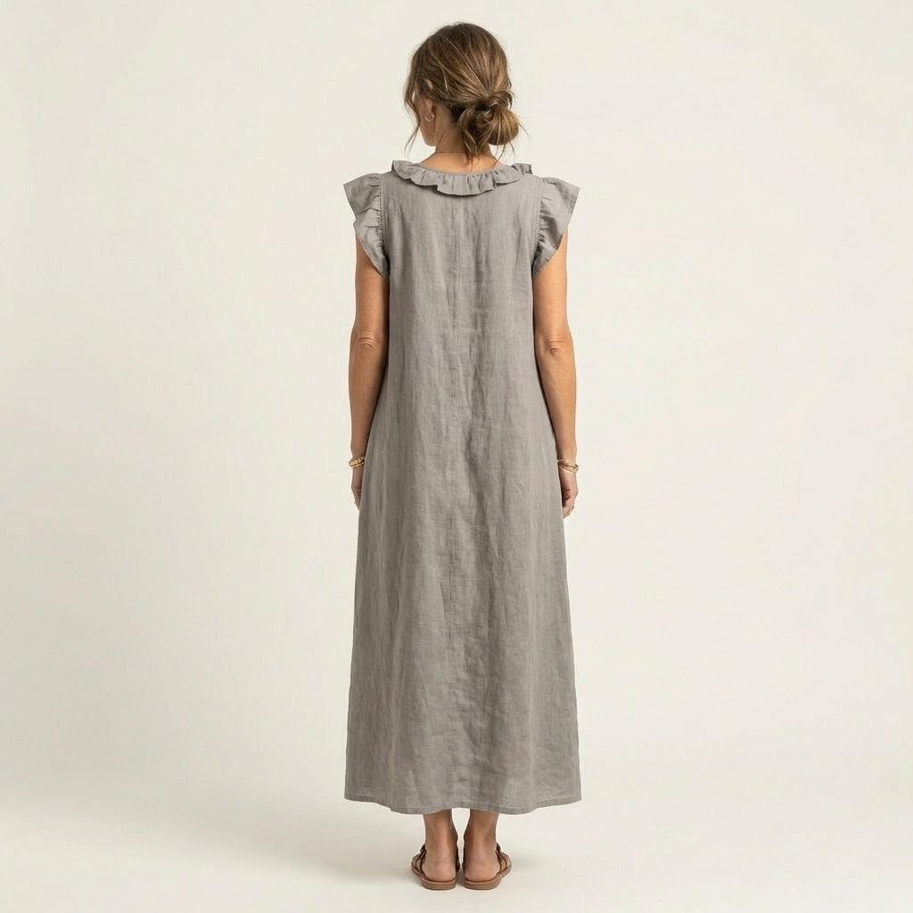 Close-up of V-neckline and ruffle detail on women's maxi dress