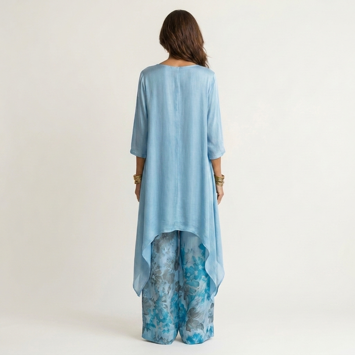 Side view of relaxed fit two-piece outfit with tunic and yellow accents