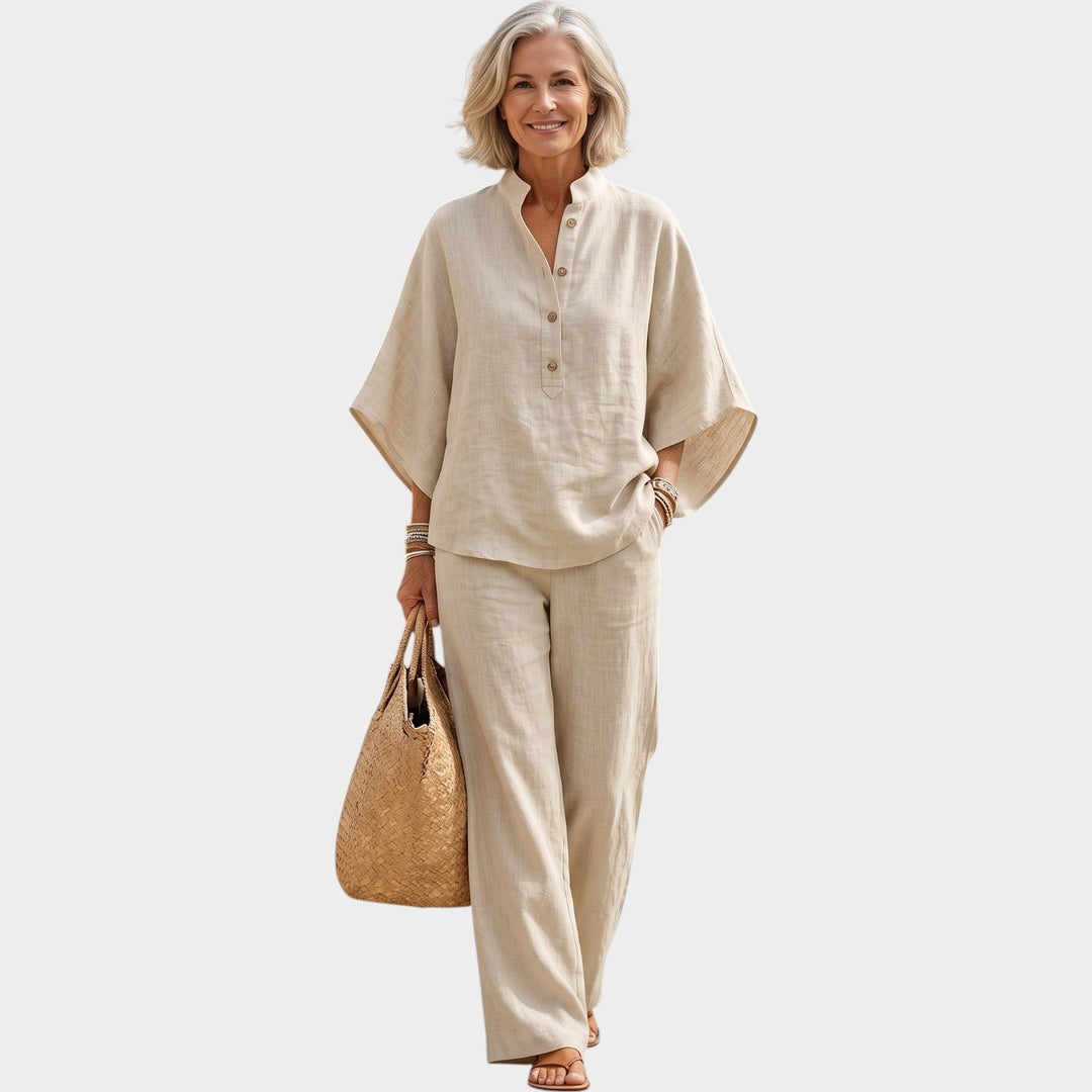 Woman wearing a beige matching two-piece outfit with button-detail top and trousers