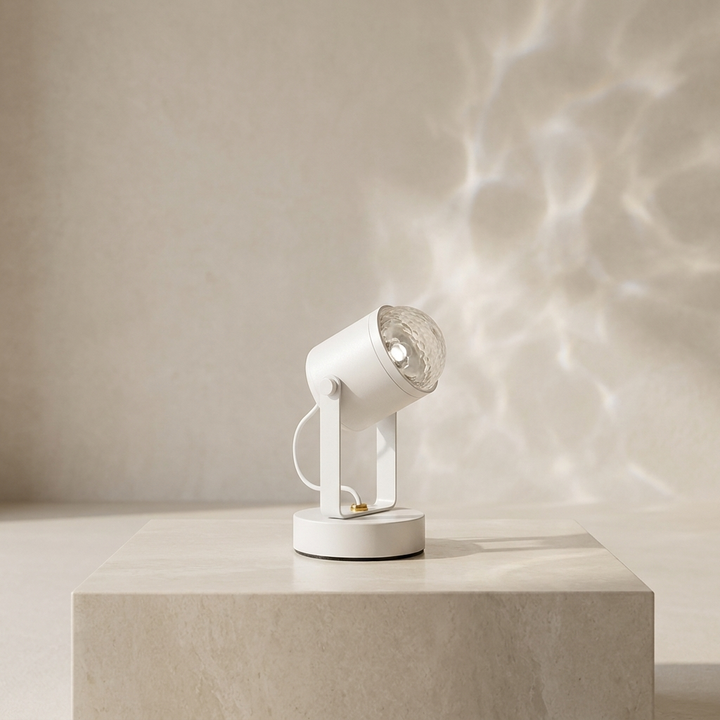 White LED RGB table lamp casting ripple light effects on a beige pedestal