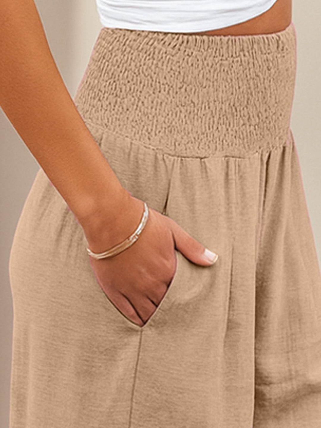 High waist palazzo trousers showing the detailed elastic smocking