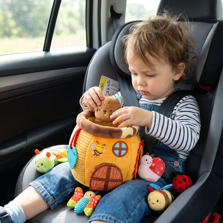 Interactive plush toy honey pot with sensory elements for early toddler play