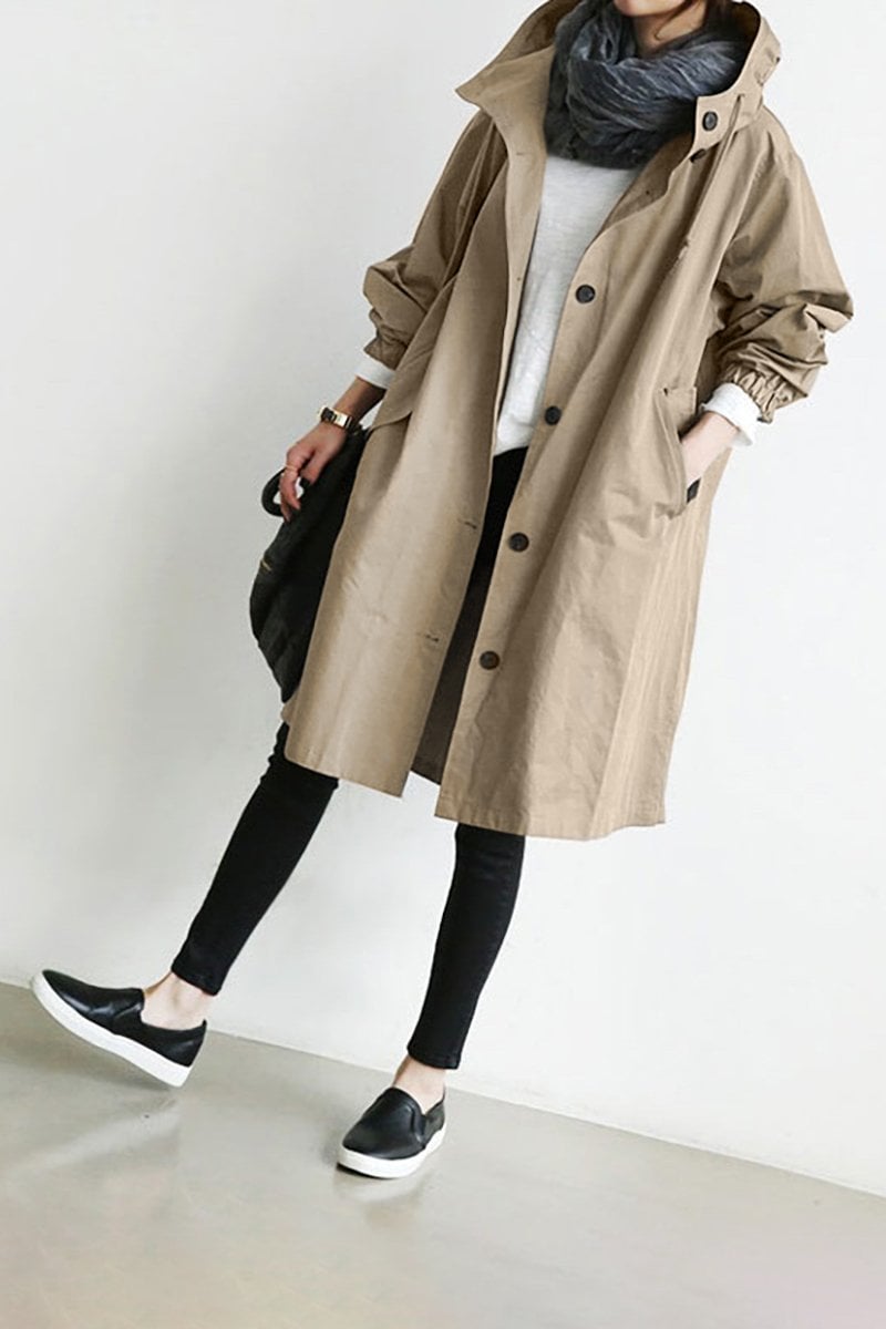 Close up of waterproof fabric and zipper on womens hooded rain coat