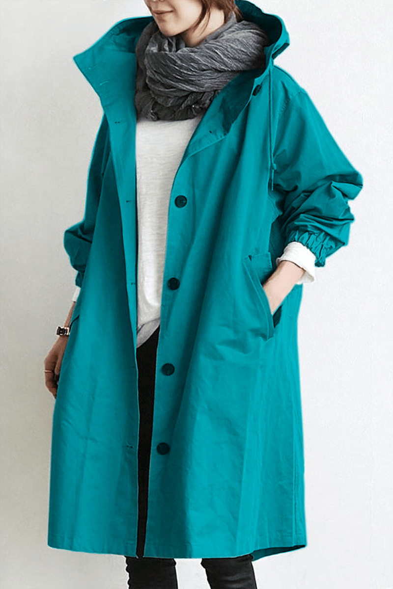 Side profile of long womens rain trench coat with adjustable hood