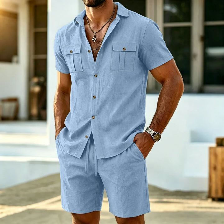 Man wearing light blue short sleeve shirt and matching shorts