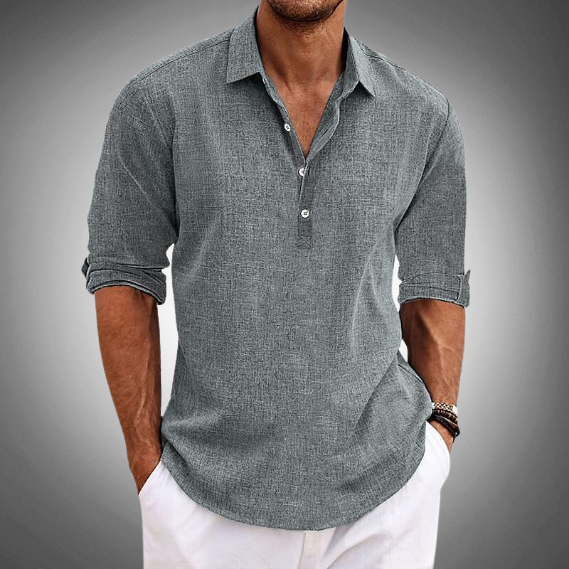 Man wearing a grey textured long sleeve shirt with button details