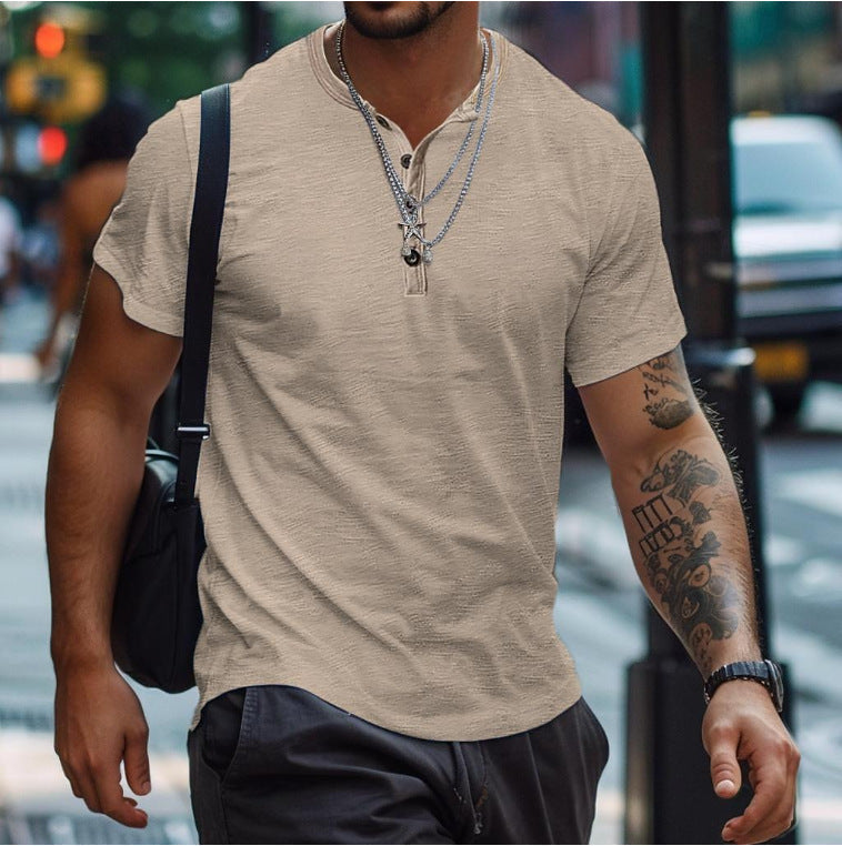 Man wearing khaki short sleeve henley t-shirt outdoors