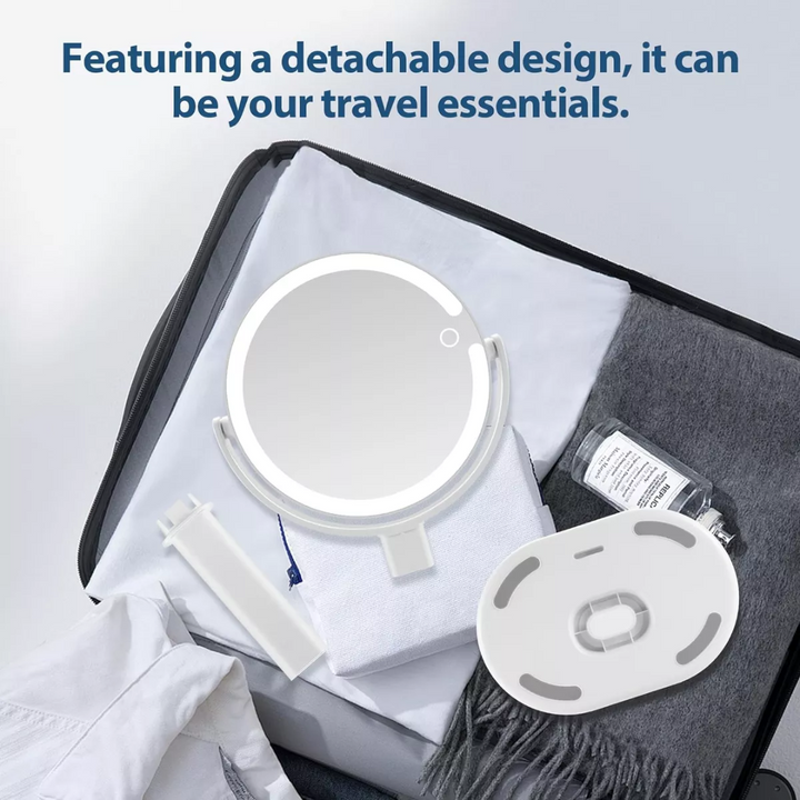Compact travel vanity mirror with lights placed on a modern white dressing table