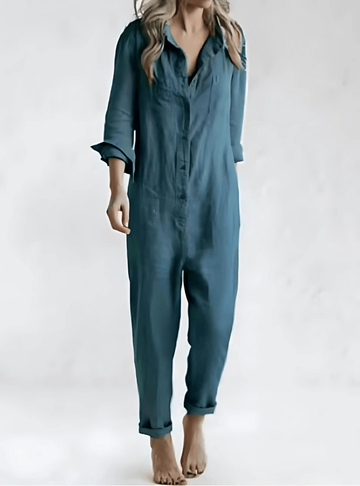 Close-up of the collar and button details on a womens one-piece utility jumpsuit
