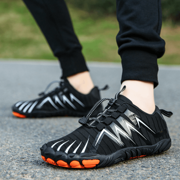 Flexible barefoot outdoor shoes bending easily to demonstrate sole mobility.