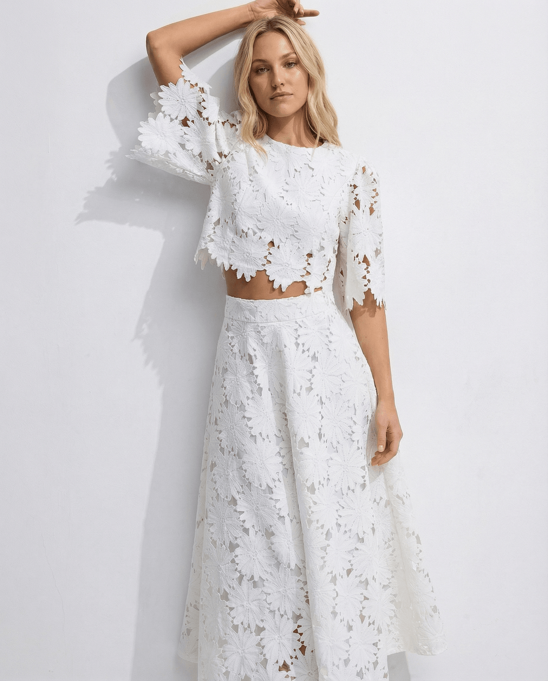 Textured fabric detail of floral lace on the cocktail dress