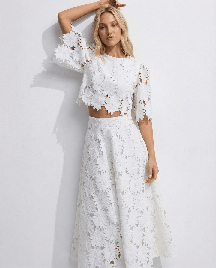 Textured fabric detail of floral lace on the cocktail dress