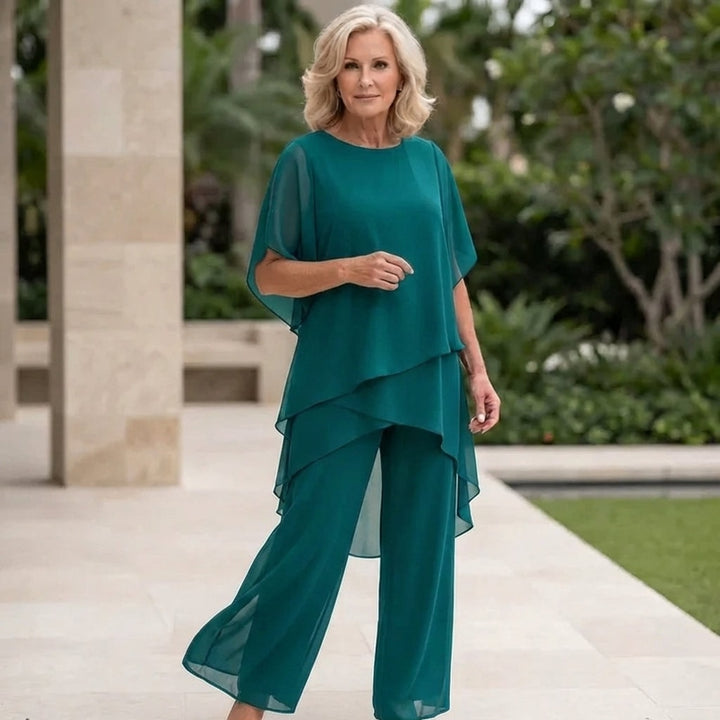 Elegant evening wear ensemble featuring a relaxed fit top and flowing trousers