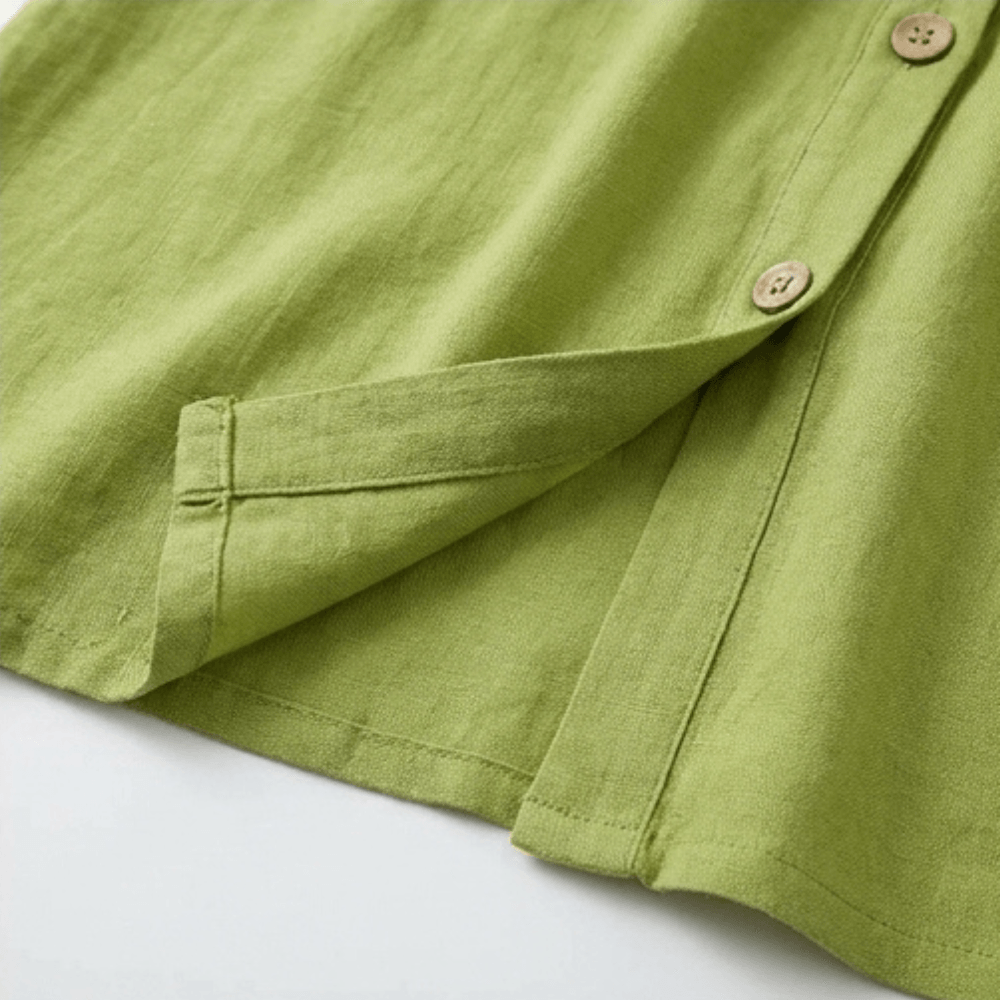 Flat lay of the olive green V-neck dress showing its full length and silhouette