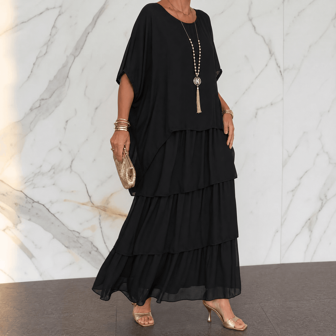 Movement shot of tiered chiffon maxi party dress