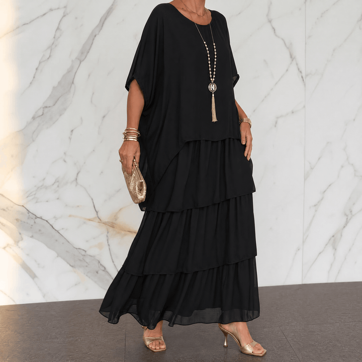 Movement shot of tiered chiffon maxi party dress