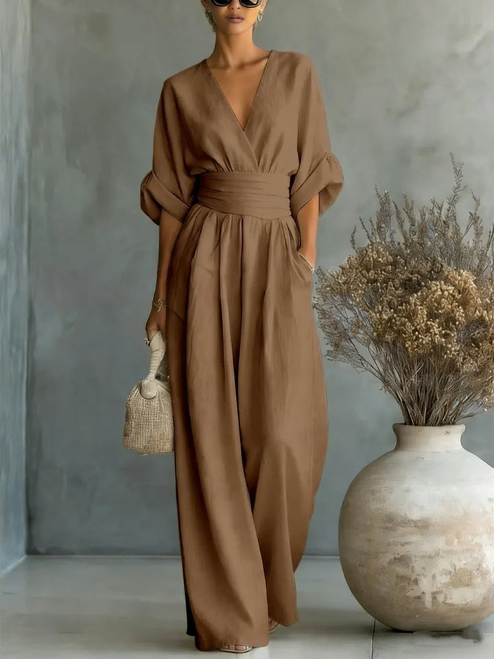 Trendy women's fashion jumpsuit styled with casual accessories