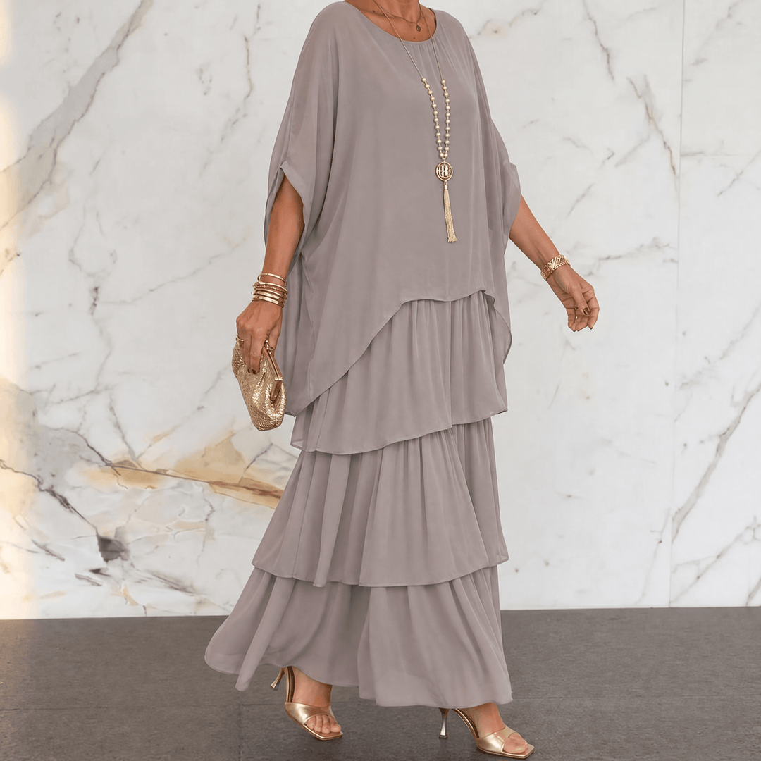 Flat lay of elegant women tiered chiffon midi dress