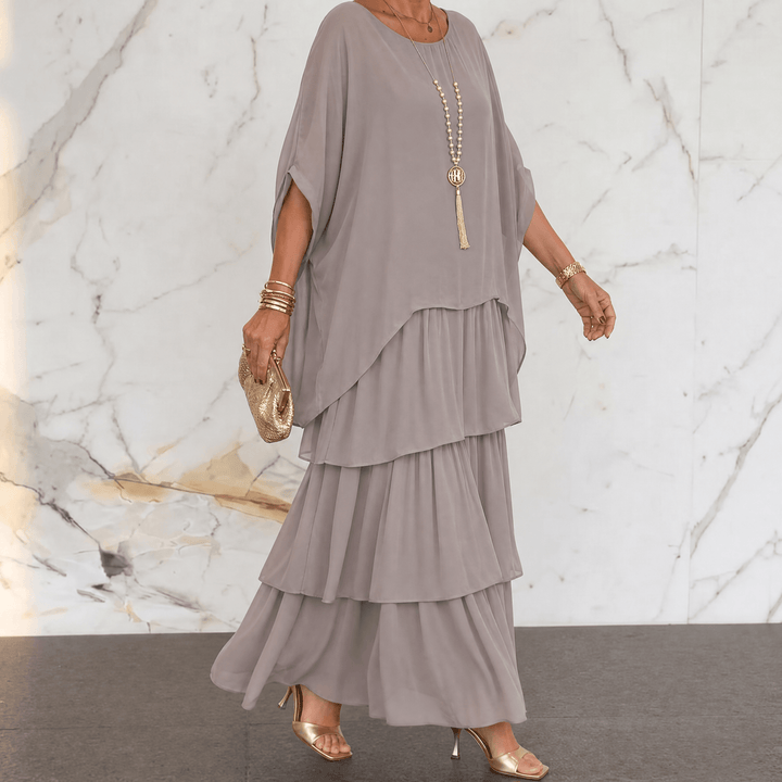 Flat lay of elegant women tiered chiffon midi dress