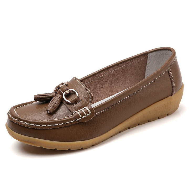 Pair of women's tassel loafers arranged neatly for everyday wear