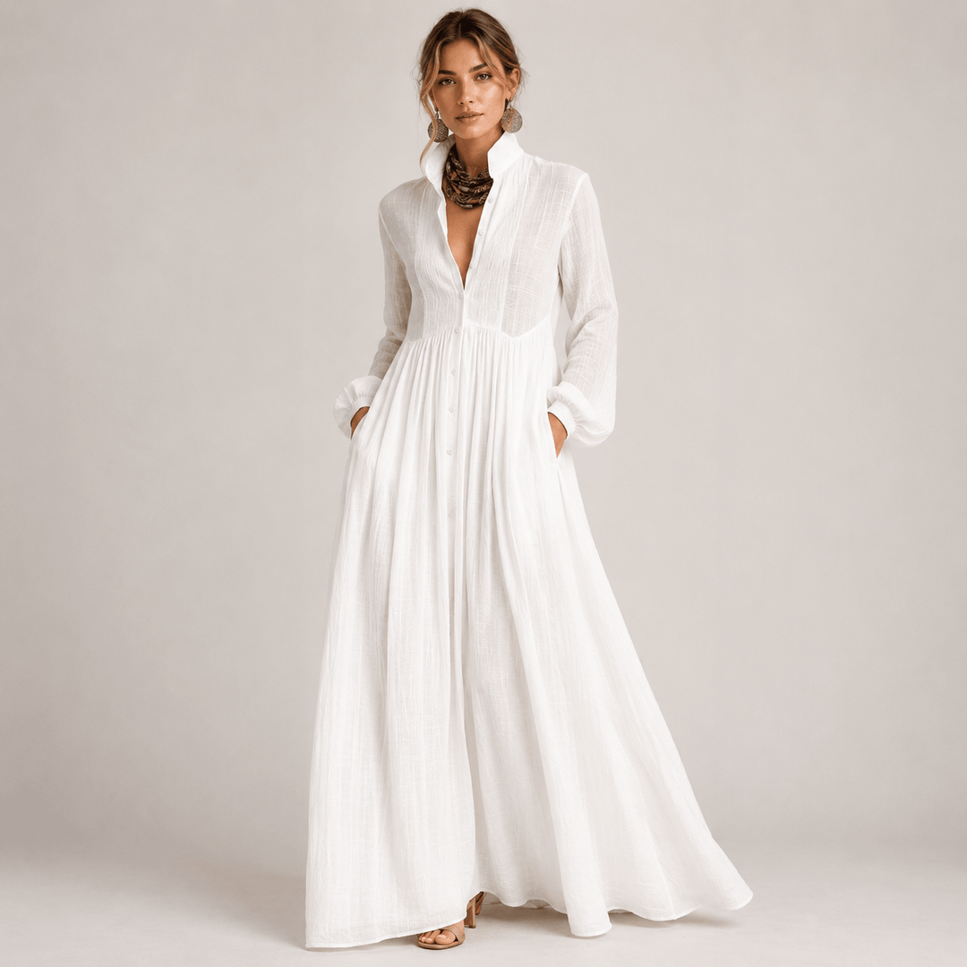 Model wearing a white long-sleeve maxi dress with collar and pockets