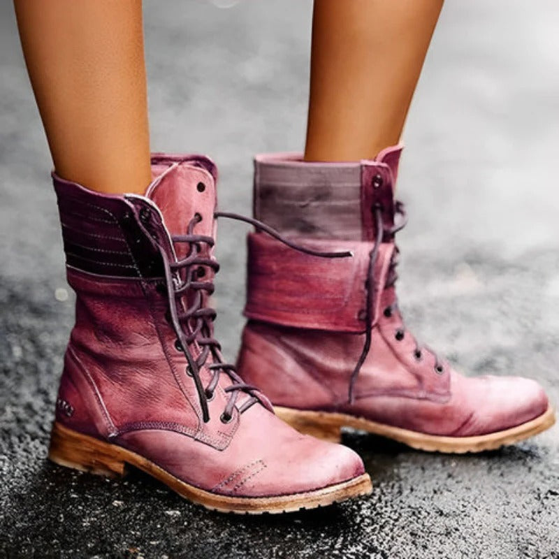 Harlow women's vintage lace-up combat ankle boots in red worn outdoors