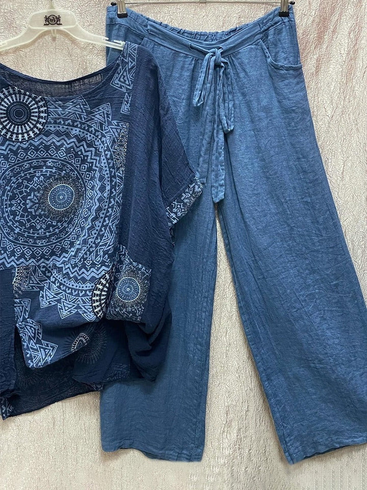 Women's blue mandala print short sleeve top and wide leg trouser set hanging on display