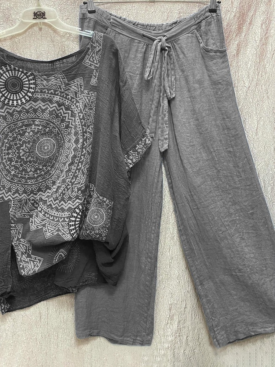 Women's grey mandala print short sleeve top and wide leg trouser set hanging on display