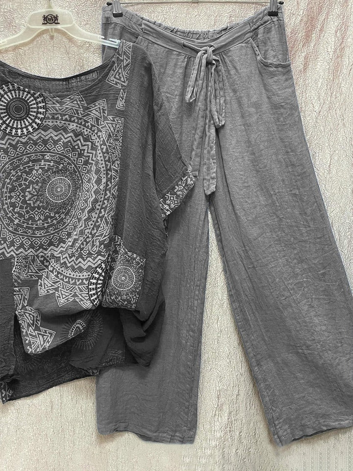 Women's grey mandala print short sleeve top and wide leg trouser set hanging on display
