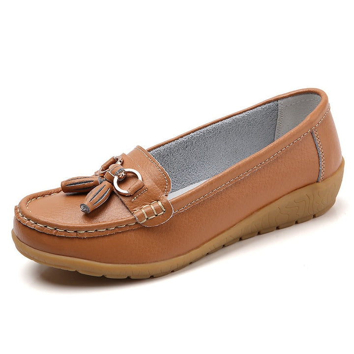 Complete view of women's comfort tassel loafer shoes in neutral color