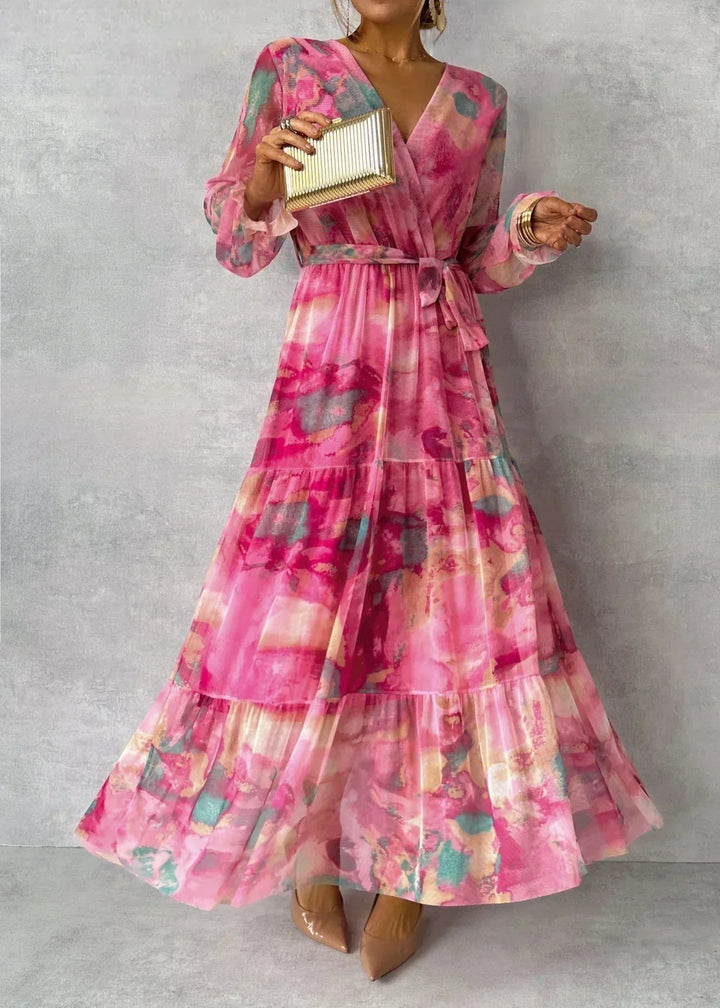 Full front view of a woman wearing a long sleeve floral maxi dress