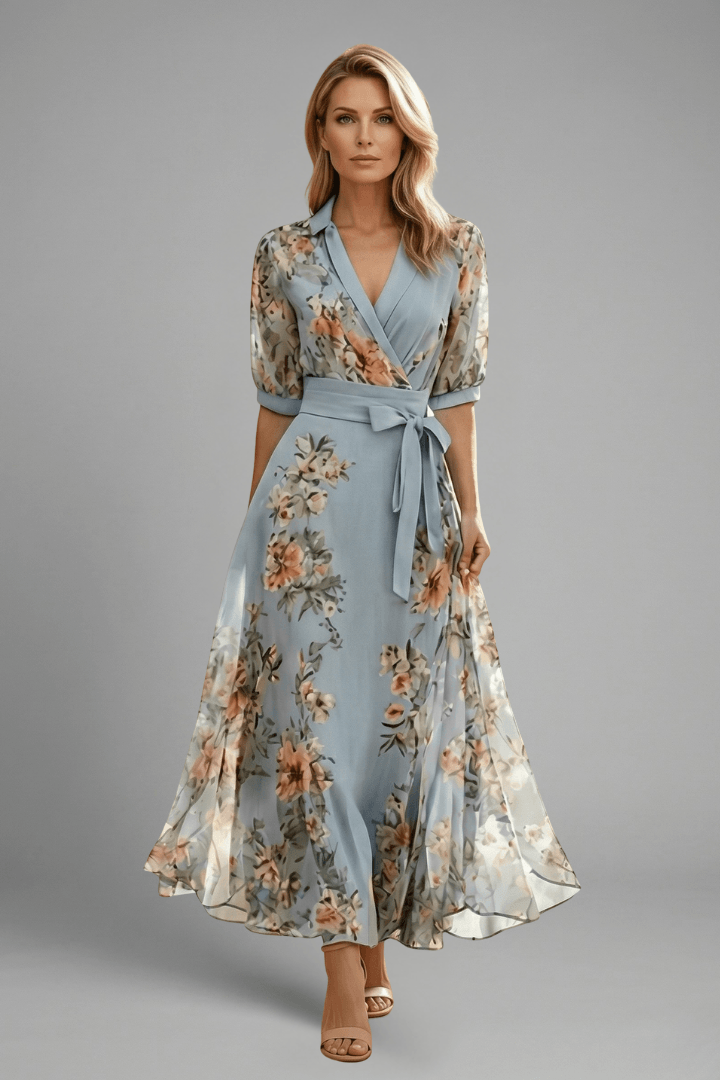 Front view of a model wearing the blue floral wrap maxi dress with heels