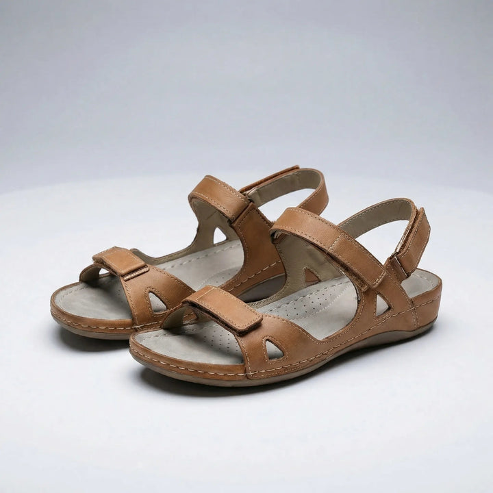 Brown orthopedic walking sandals displayed on a neutral background