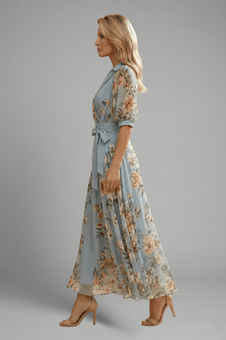 Side profile of a model wearing the blue floral wrap maxi dress