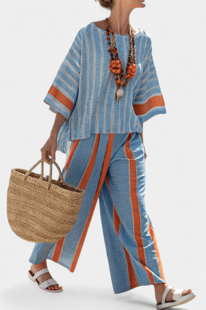 Close-up of the striped co-ord set showing the fabric drape and vertical stripes