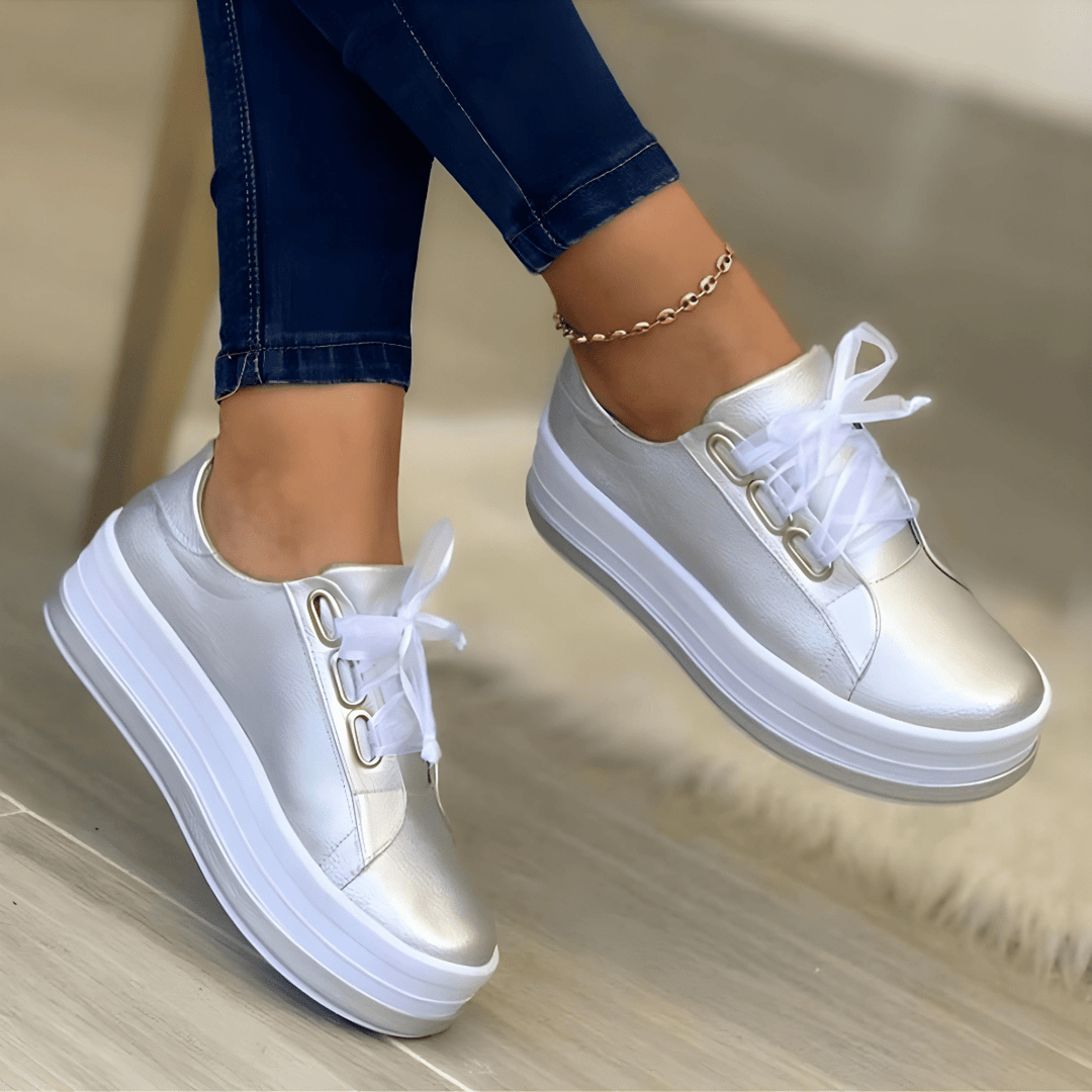 Silver women's platform sneakers styled with casual denim