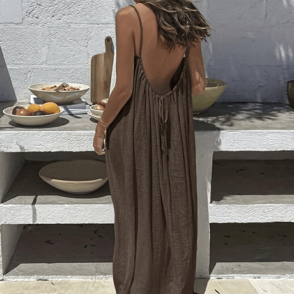Back view of a flowy women's backless maxi dress in a summer casual style
