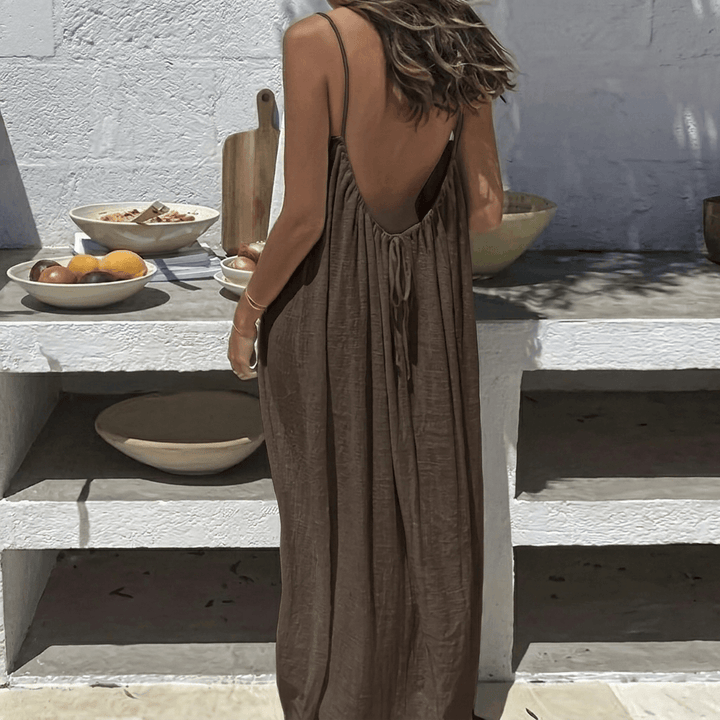 Back view of a flowy women's backless maxi dress in a summer casual style