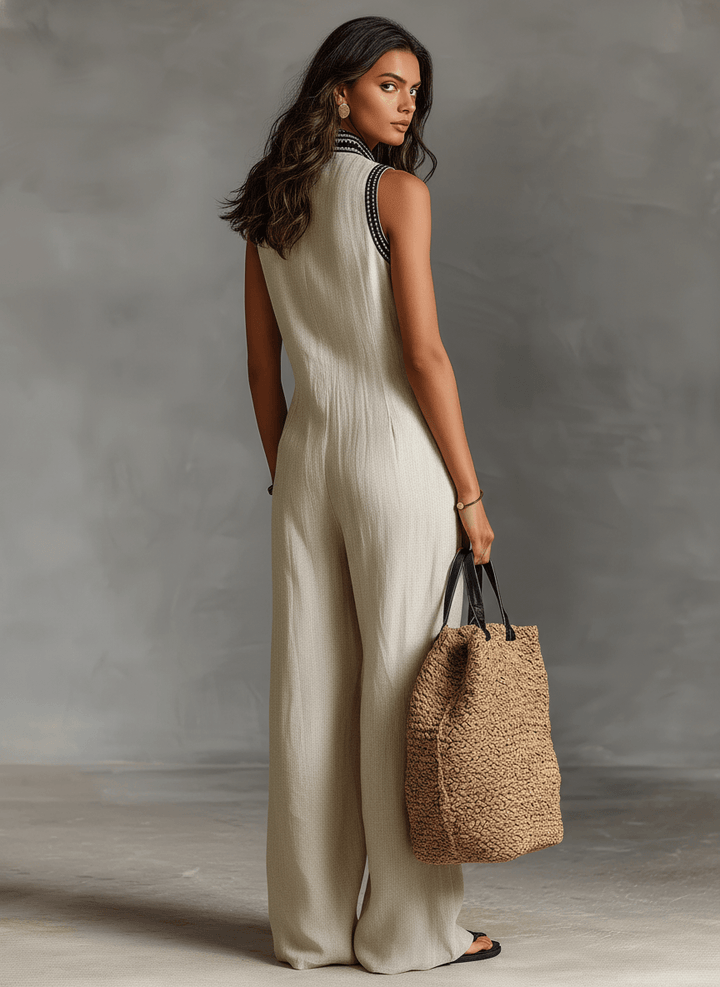 Side view of women's sleeveless embroidered wide leg jumpsuit for summer