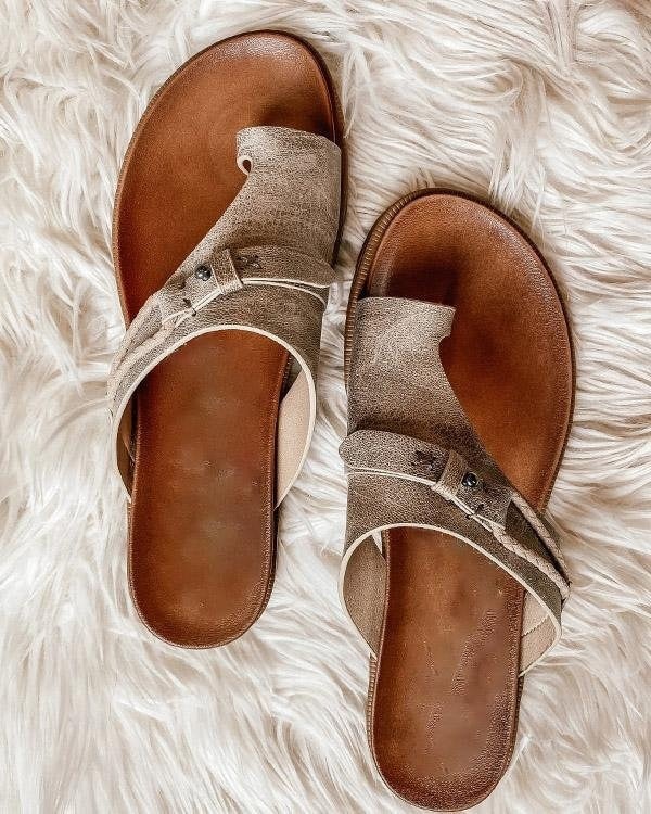 Women's comfortable toe-loop flat sandals in summer footwear design, side angle
