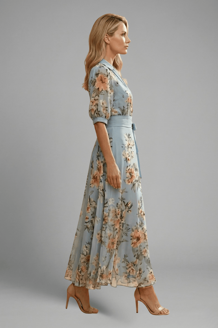 Side view of women's blue floral wrap maxi dress showing flowing skirt