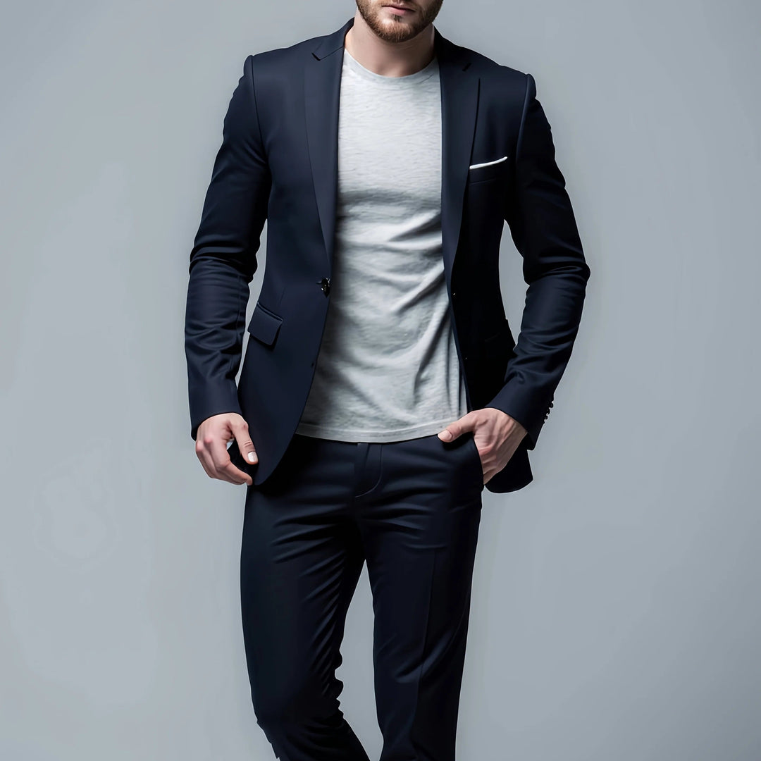 Man wearing a dark navy blue slim fit suit jacket paired with casual shirt