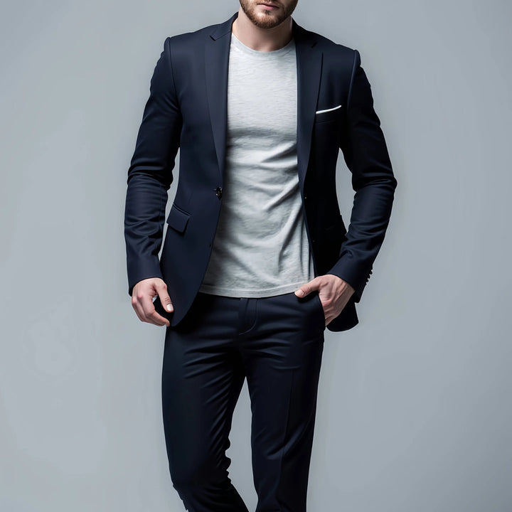 Man wearing a dark navy blue slim fit suit jacket paired with casual shirt