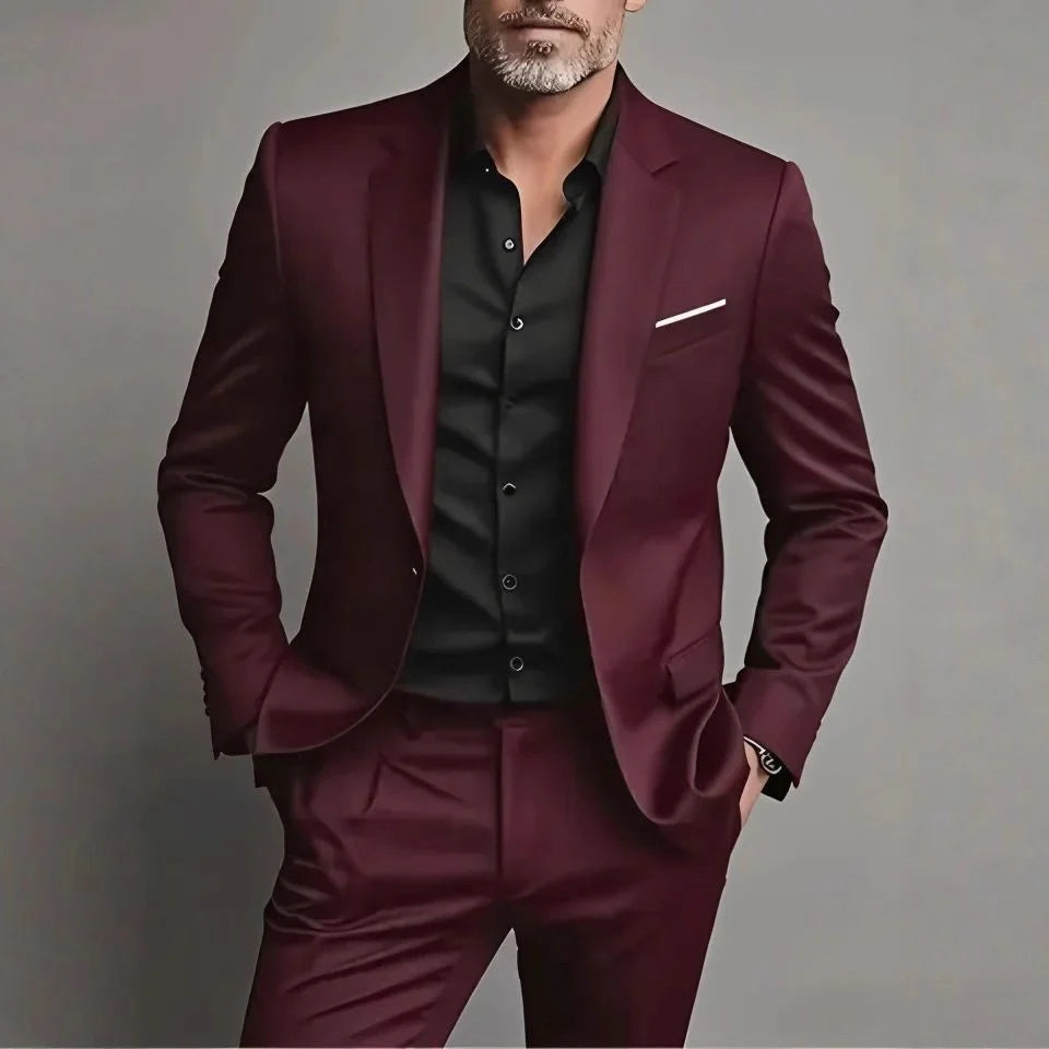 Close up of a man wearing a burgundy slim fit suit set with structured blazer