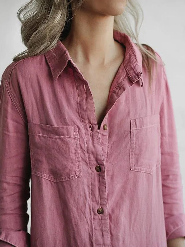 Close-up view of the button-front closure and chest pocket on a womens utility jumpsuit