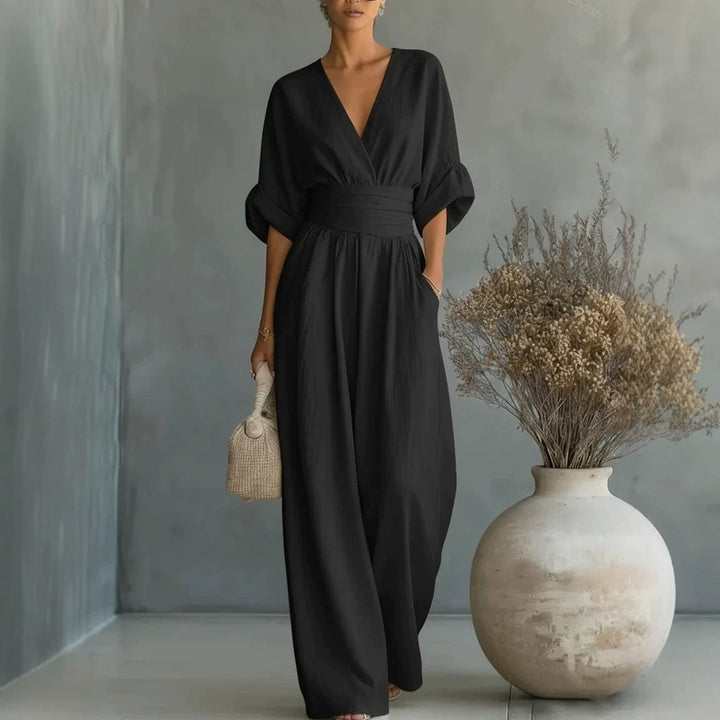 Casual wide-leg jumpsuit featuring long balloon sleeves and waist tie
