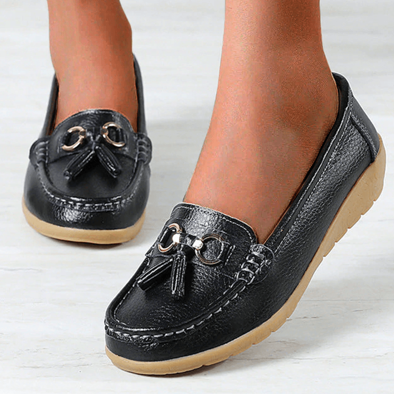 Side view of women's casual tassel loafers showing flexible walking shoe sole
